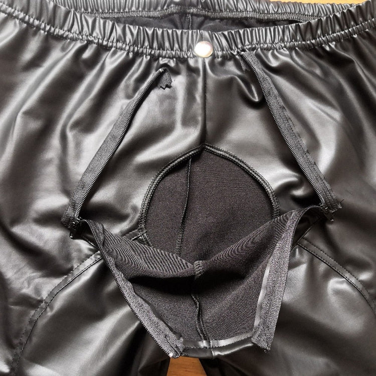 X Men Leather Trousers in glossy black PU leather with an elastic waistband, zipper fly and open front detail