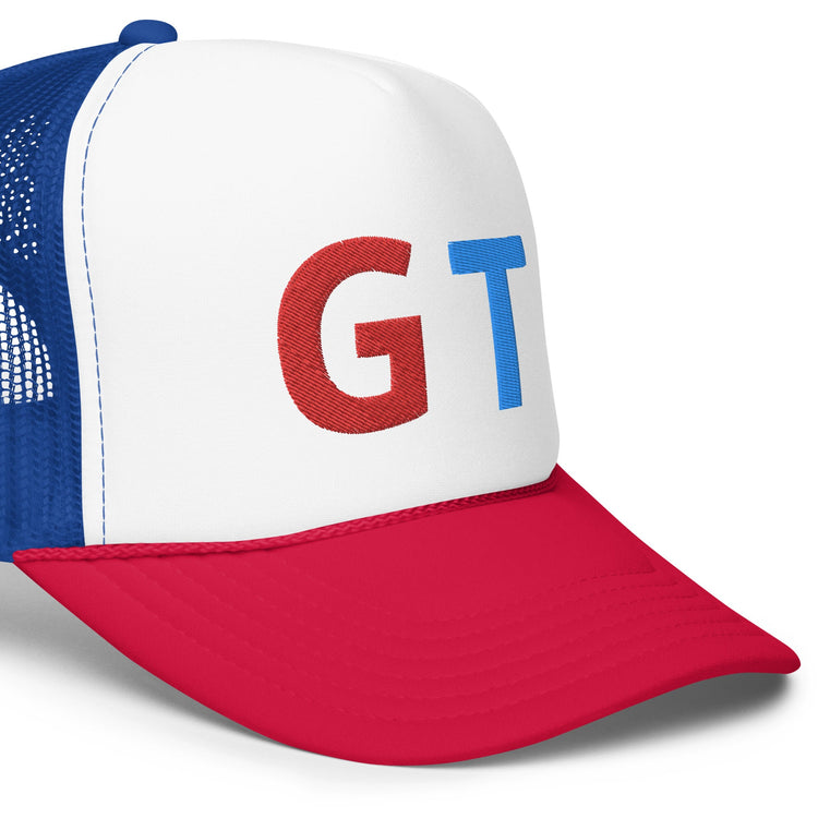 Trendy foam trucker hat with white front, blue mesh back, red visor, and bold red and blue GT lettering